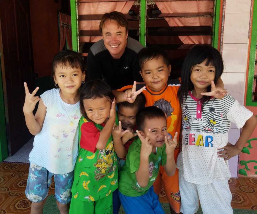 Mr. Rogers make some friends during his surf trip to Indonesia