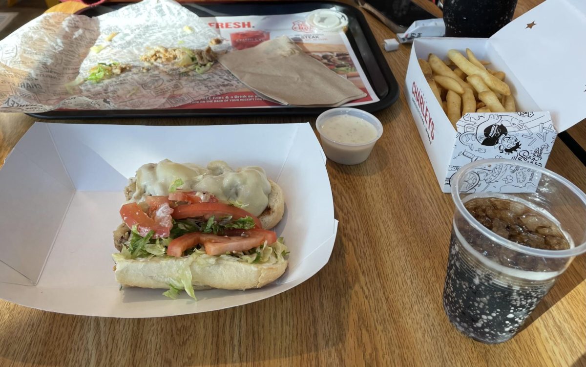 Silva enjoys a Philly cheesesteak at the new restaurant