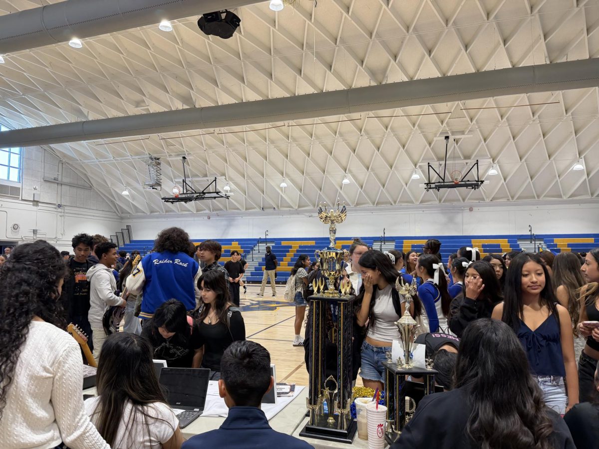 Ocean View Middle School students walk around to get information on CI programs and clubs 