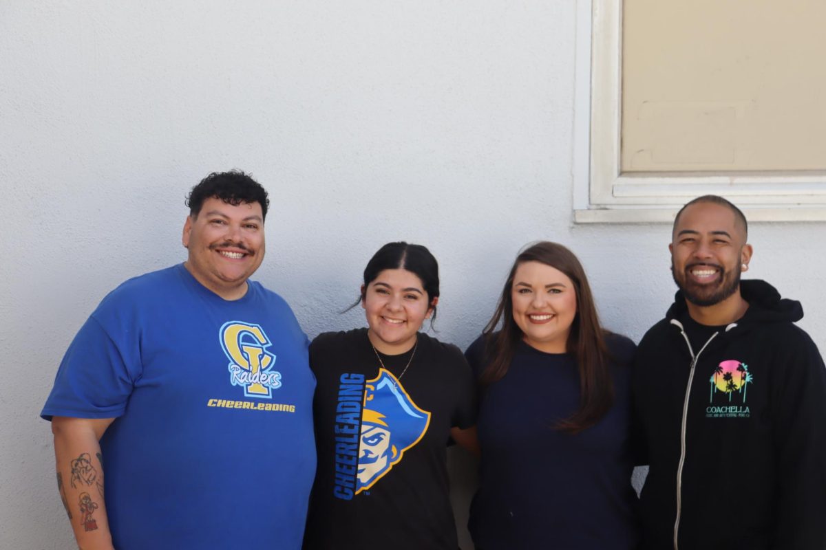 Sanchez poses with her coaches