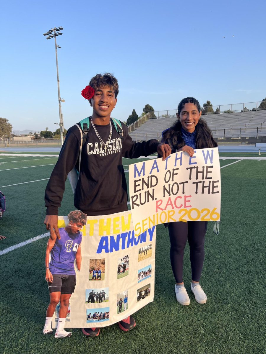 Matthew and his sister coach Magen pose at his senior night this past Thursday